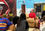 UGA Road Dawg Maggie Graig spends time getting to know high school students at the DeKalb School of Arts. (Photo courtesy of Matt Huberty)