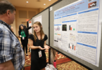 Laura Kate Holden, center, is a fourth-year CURO Honors Scholar studying biochemistry and molecular biology. She will introduce the keynote speaker and her faculty mentor, Lance Wells, and present her research during the poster session. (Photo by Stephanie Schupska)